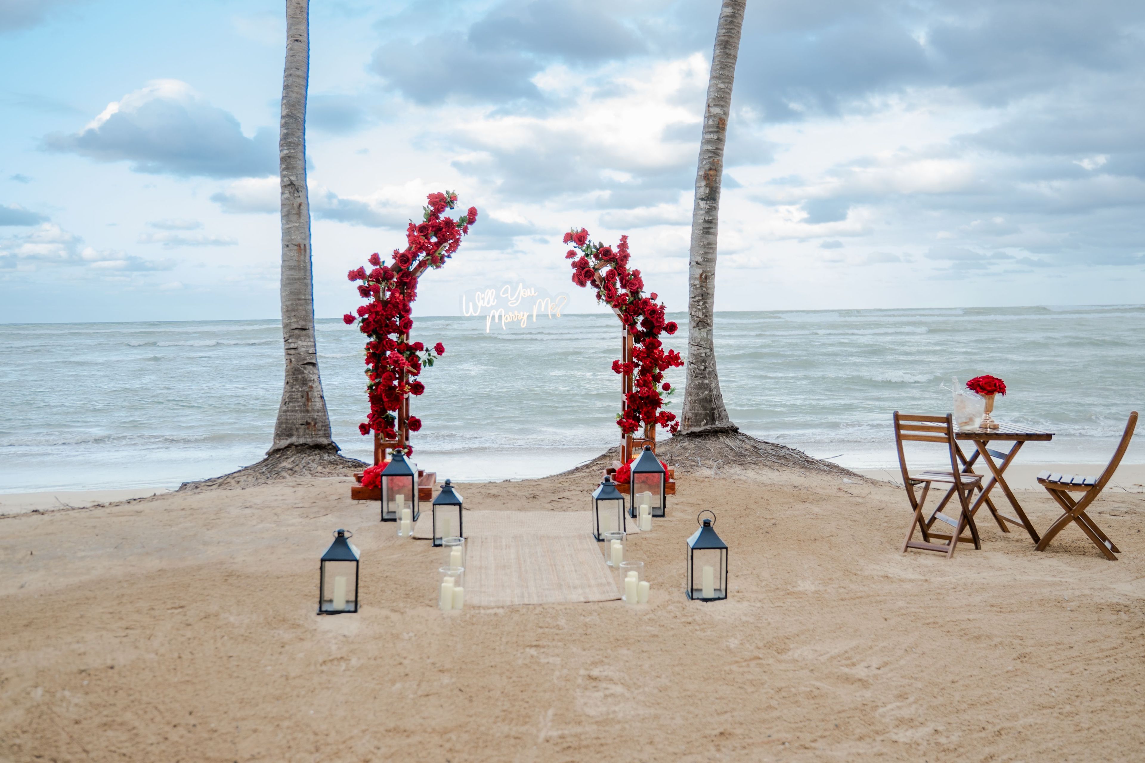 Beach proposal Punta Cana romantic setup candles sunset