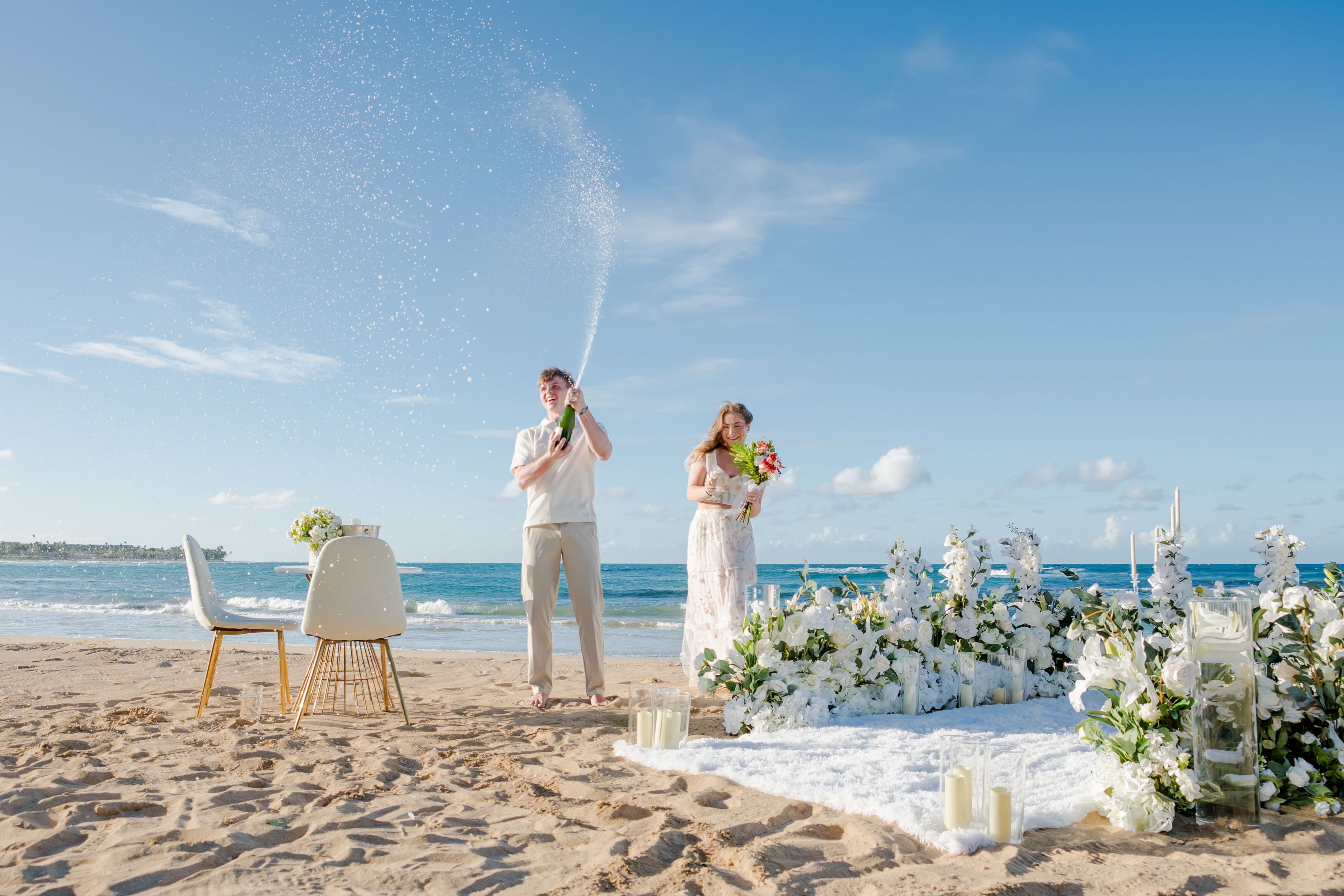 Beach proposal Punta Cana candles flowers dinner setup