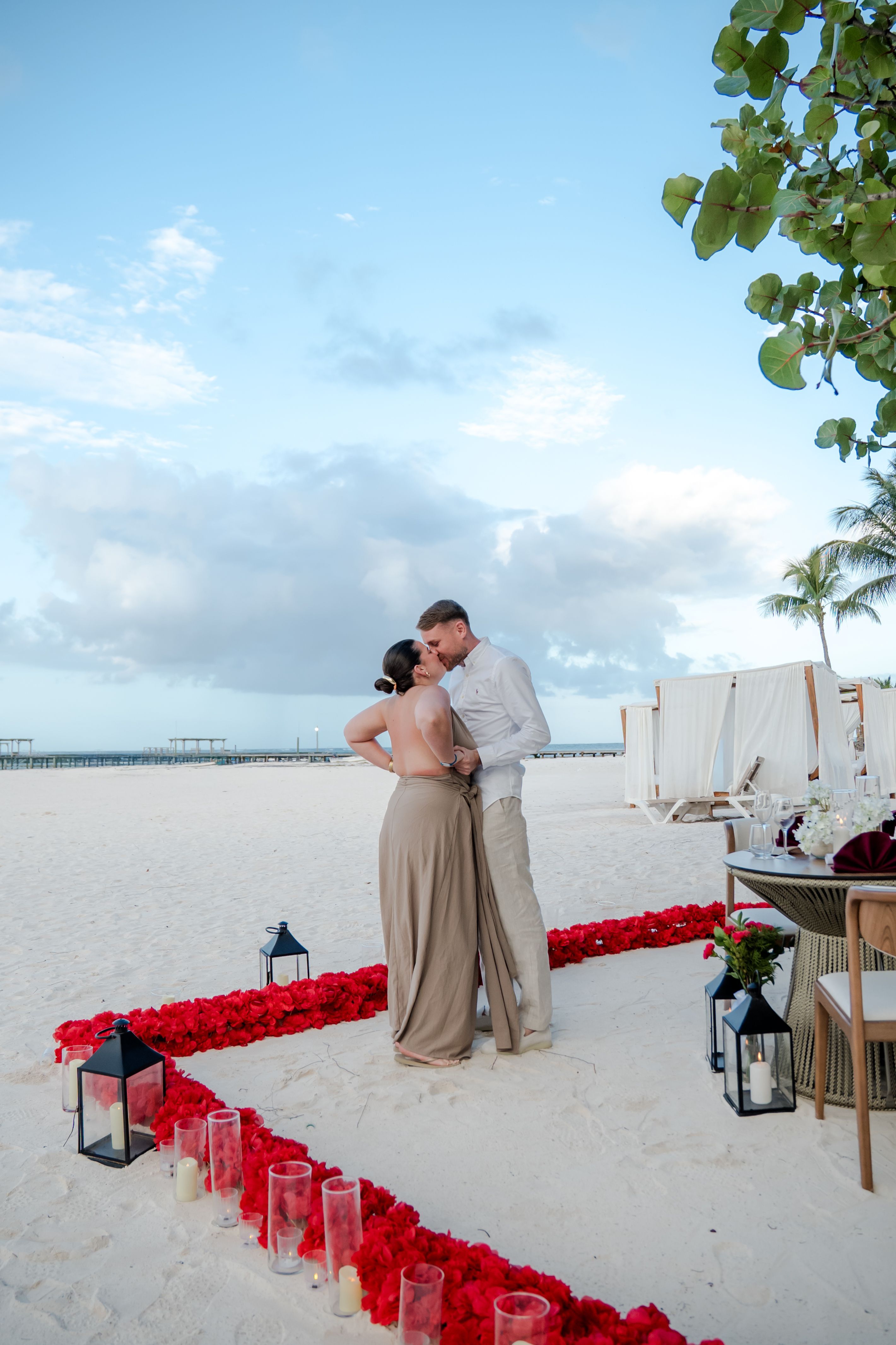 Punta Cana proposal beach setup candles flowers dinner